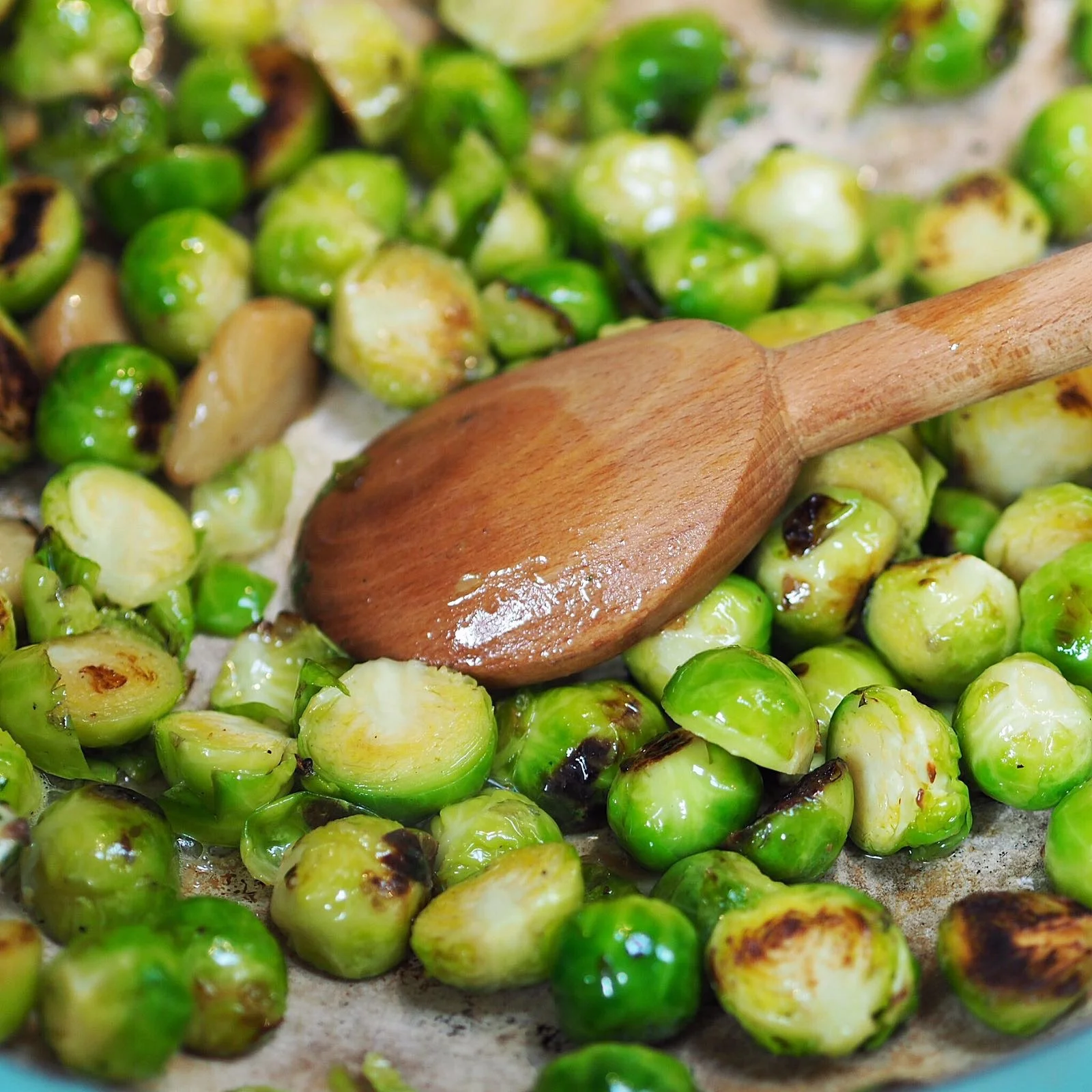 Roasted brussel sprouts with confit shallots and anchovy butter. photo Emma Parlons