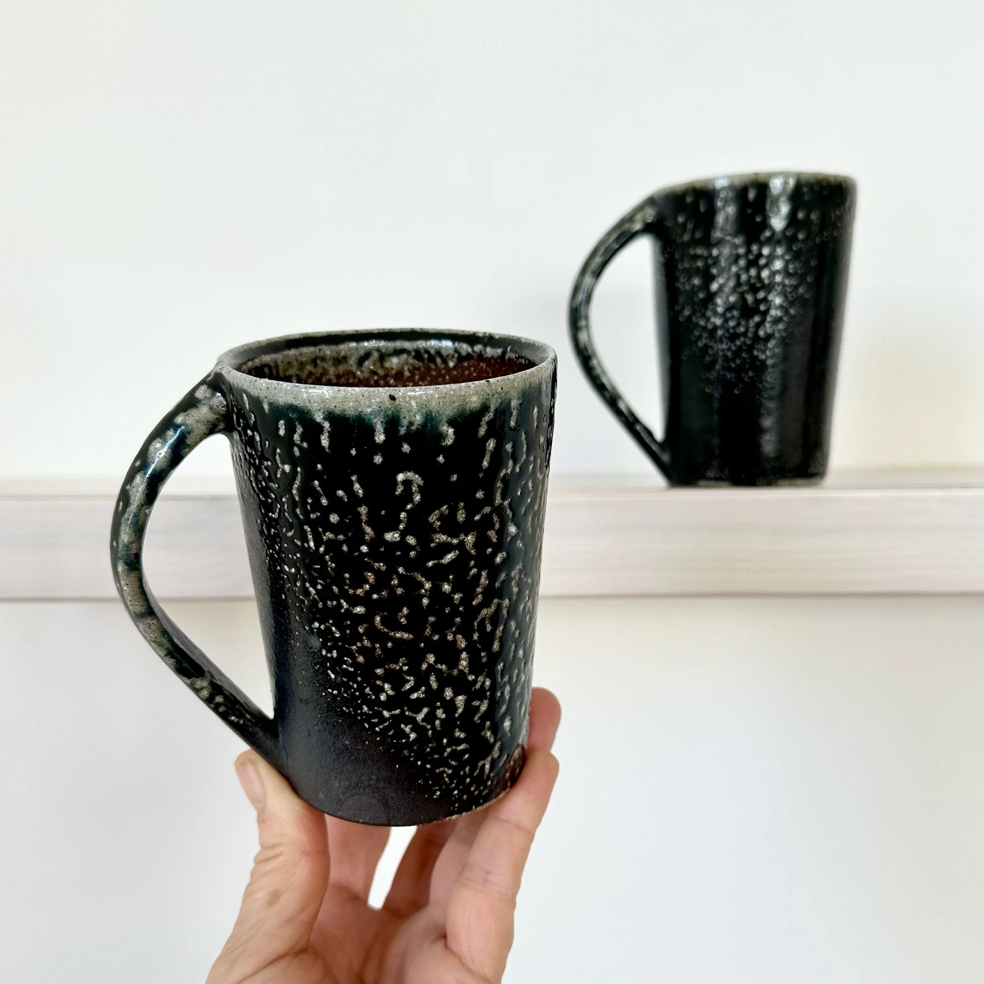Pair of Tall Black Mugs