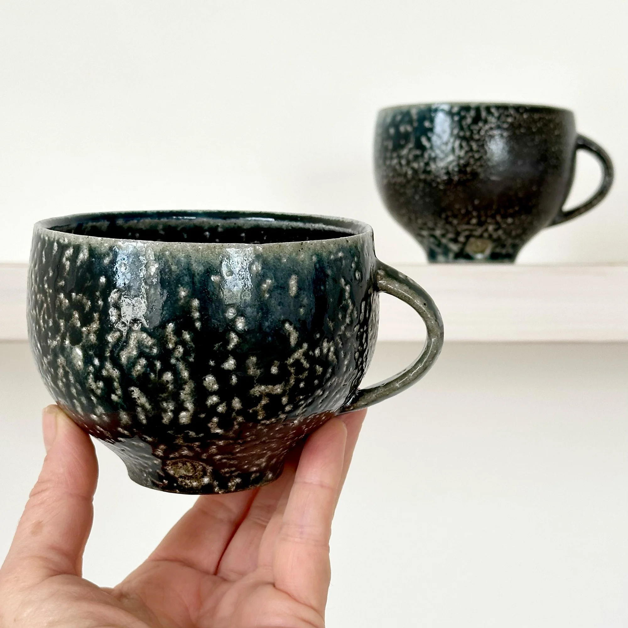Pair of Black Teacups