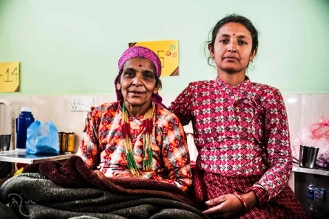 Juna Devi BhattArai Juna Devi Bhattarai (54 yrs.), with her daughter Sanjita Bhattarai. Juna developed first signs of prolapse at 51. Her current workload includes farming, cooking, washing dishes and clothes, cleaning and looking after her grandchildren.