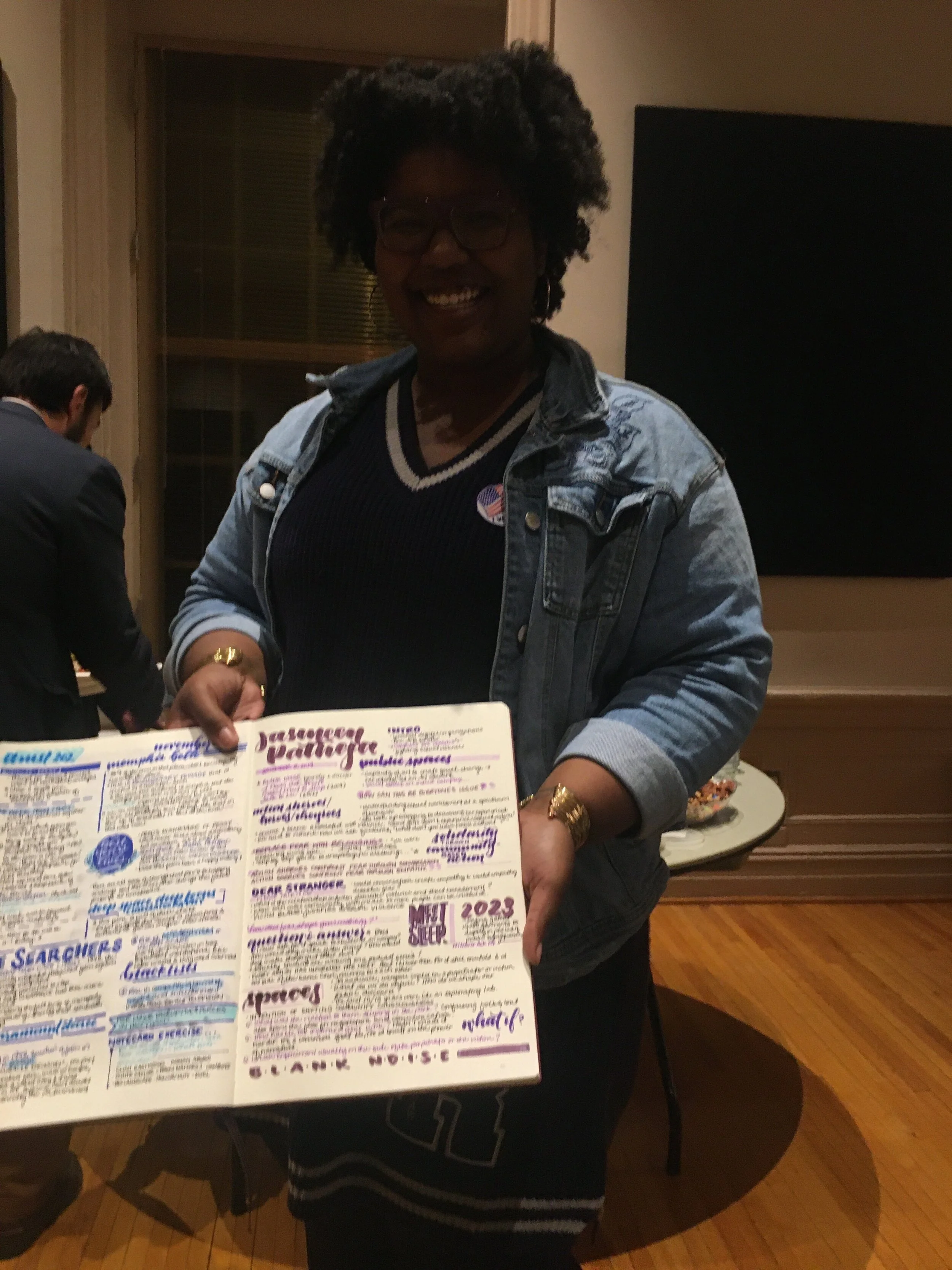 Student with sketch notes from the I Never Ask For It Campus Talk at William and Mary College, Williamsburg
