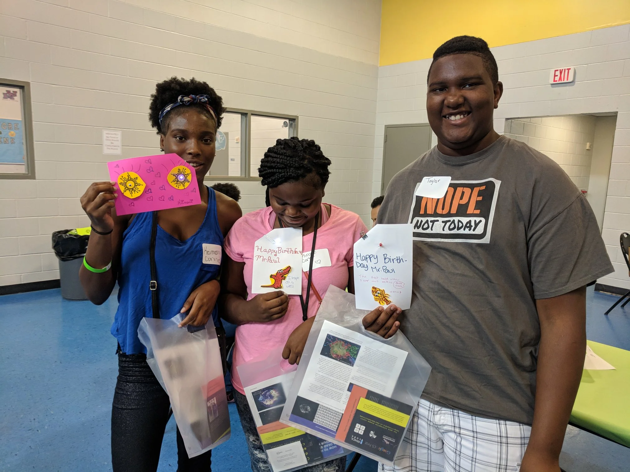 Students holding up the cards they made for Mr. Paul at the one day STEM Camp at Finnigan Park Community Center. July 7th 2018. Courtesy of Wanjun Zhang.