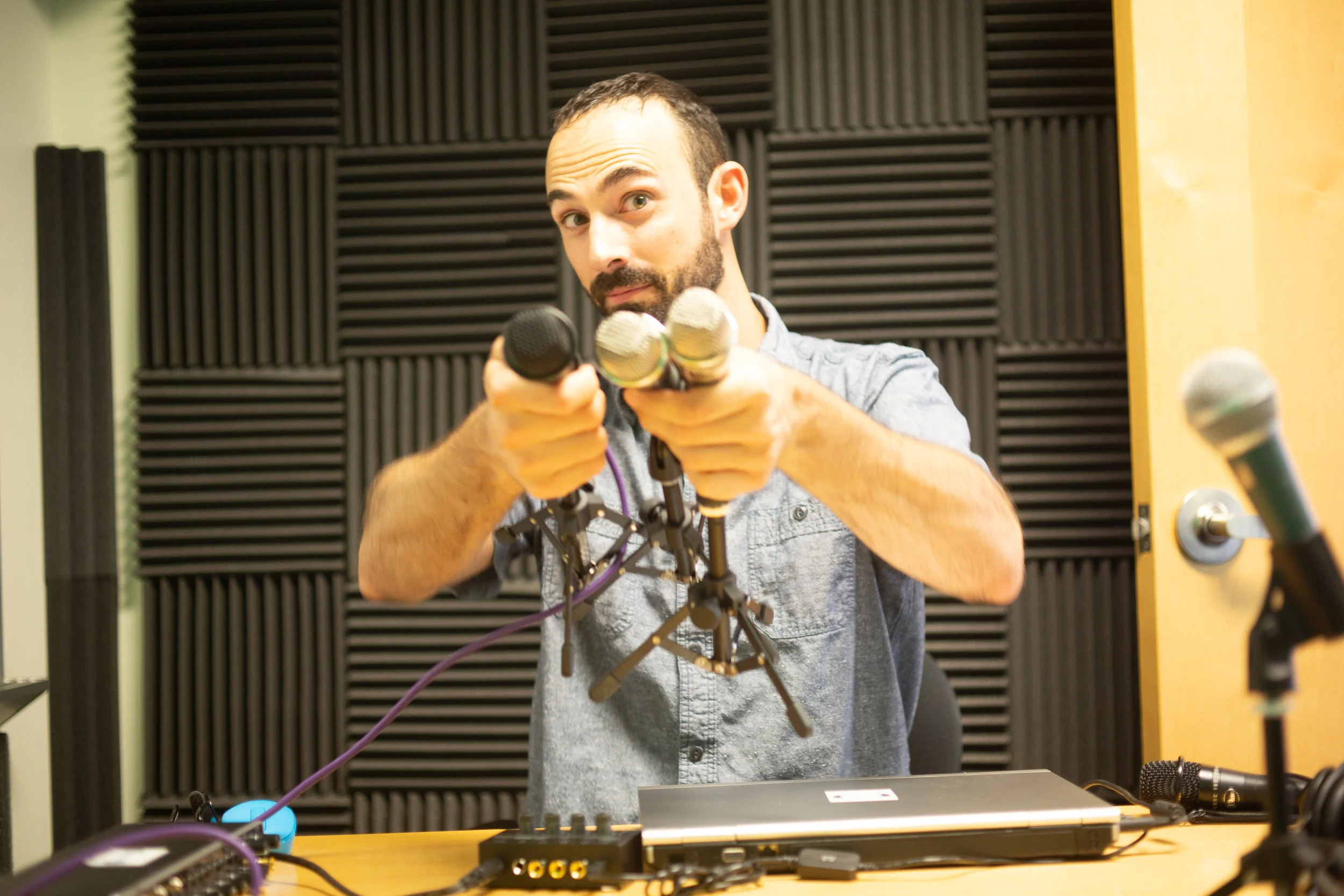 Andrew Karnavas, founder of Andyrooniverse and Just Add Beats checks his mics for the podcast at Station Houston. July 11th, 2018. Courtesy of Wanjun Zhang.