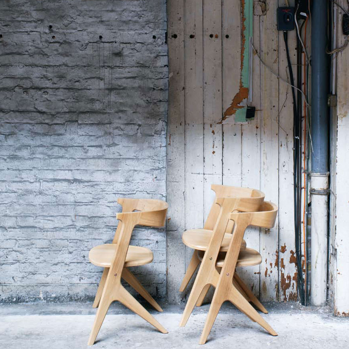 Originally intended for another manufacturer who had the solid timber steam bending facilities with which to form the back and arm in a single piece. However this factory did not have that capability and instead form the back by blocking out and machining. Still in production after 11 years.