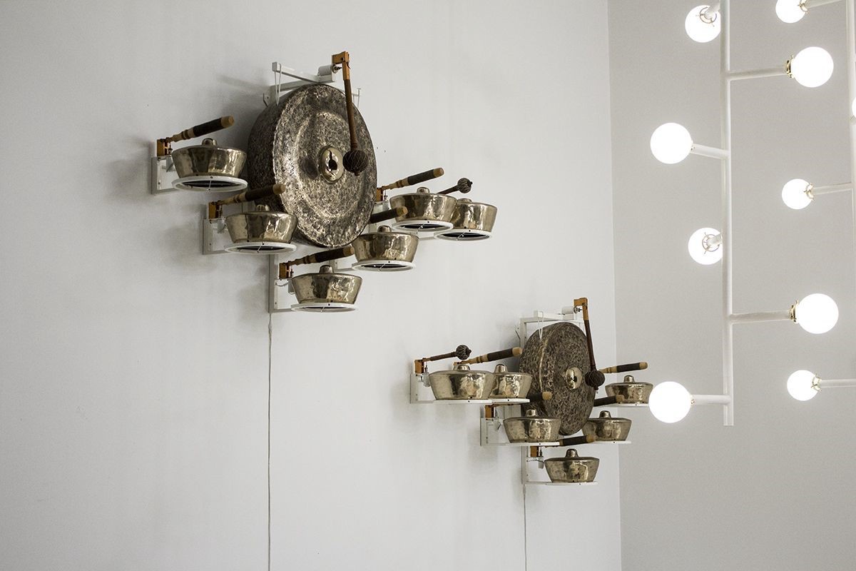 Gamelatron Dewata Damai (Indonesian: The Gods of Peace) 2017 Balinese Bronze Gongs, White Powder Coated Steel, Teak and anodized copper robotics, physical computing system 71 x 14 x 36 in ( 180.34 x 35.56 x 91.44 cm )