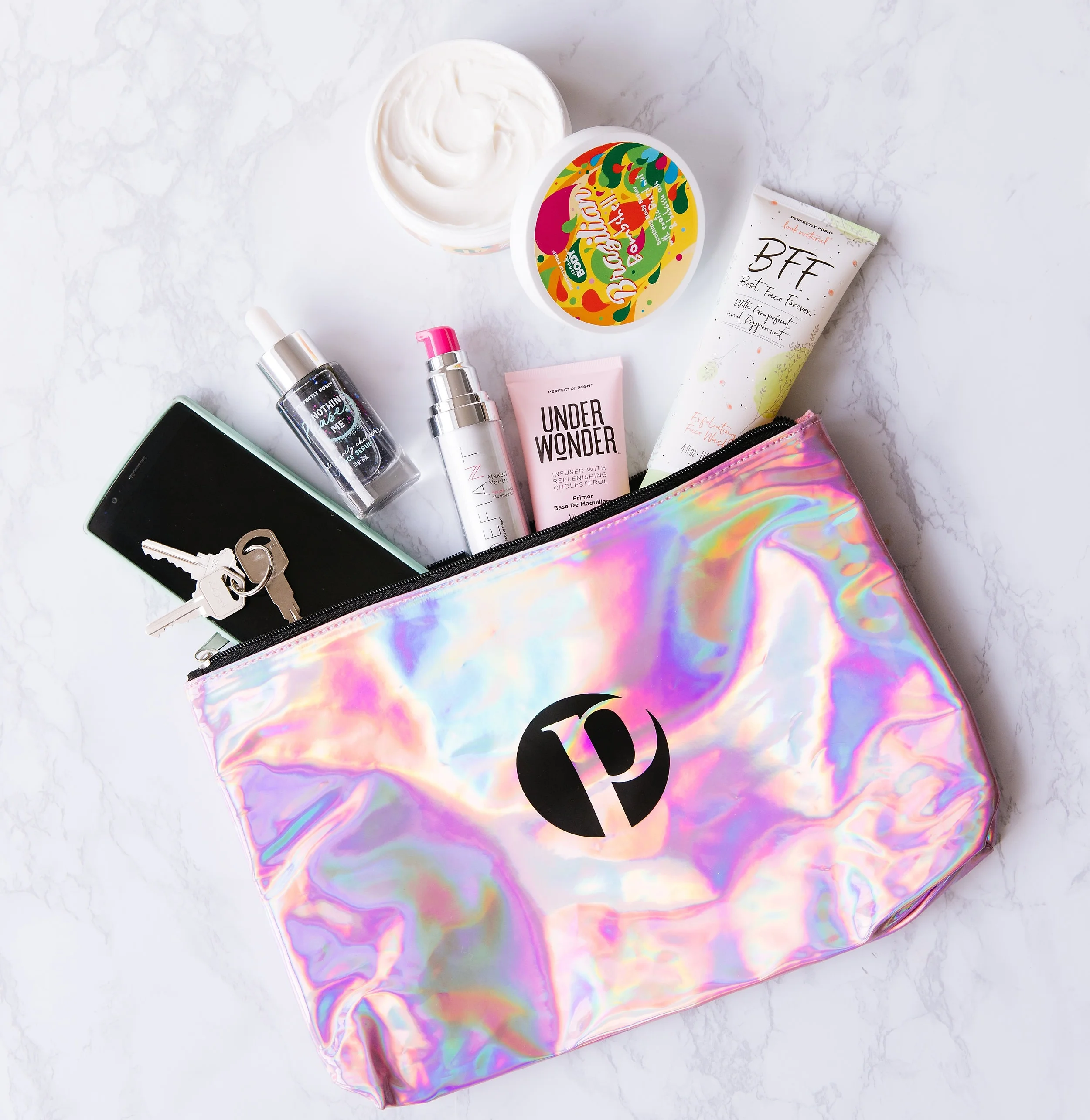 Perfectly Posh Consultant Sara McCarthy’s bag, Defiant Naked Youth Serum, moringa oil anti-aging serum, BFF: Best Face Forever Exfoliating Face Wash, naturally based peppermint and grapefruit face scrub, Under Wonder Replenishing Cholesterol Primer, anti-aging makeup primer, Brazilian Bombshell Body Butter, Shea Sisterhood body butter, sustainably sourced shea butter body butter, Nothing Phases Me Anti-Gravity Cholesterol Serum, vegan cholesterol face serum, activated charcoal face serum
