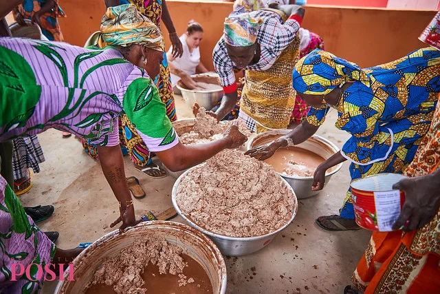 The Shea Sisterhood mixes shea butter to separate the oil for Perfectly Posh products.