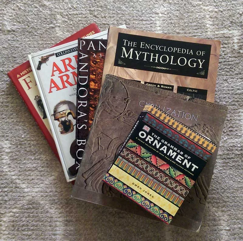 Some of my reference books - covering art objects from museums, mythology with art, ornamentation from Victorian copy books, arms and armour books, and costume books