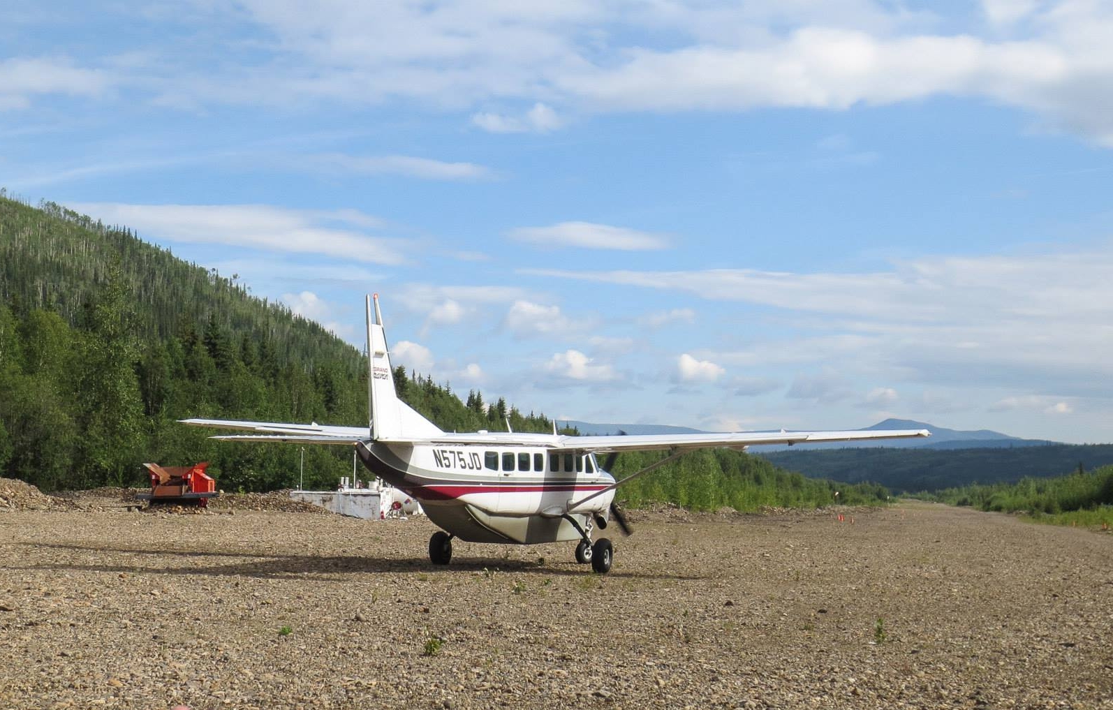 Caravan plane arrives at the gravel runway at Coal Creek Camp bringing the 2014 participants.