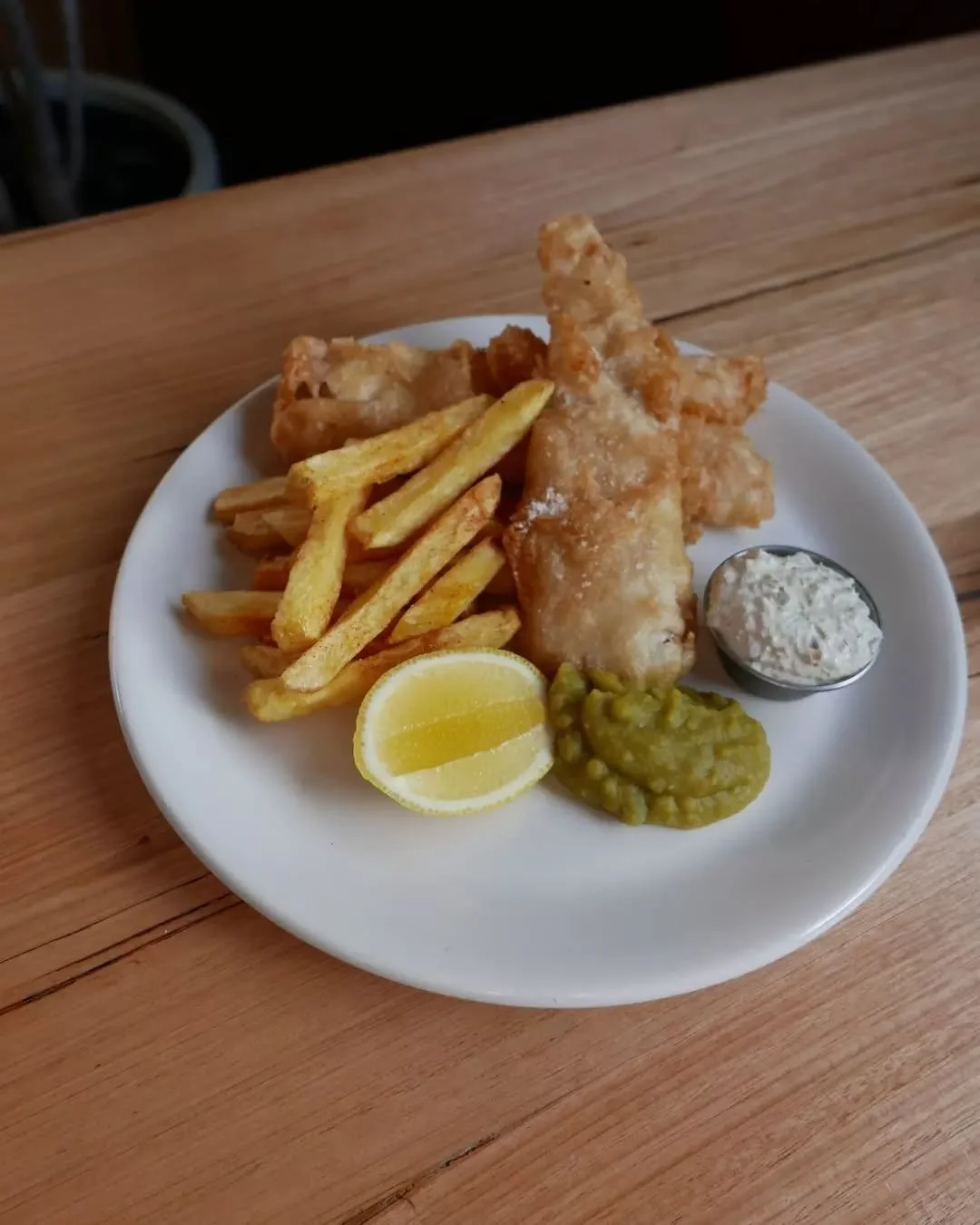 Beer-battered fish &amp; chips, mushy peas, hand-cut chips.&nbsp;

Open from 12pm - see you soon!