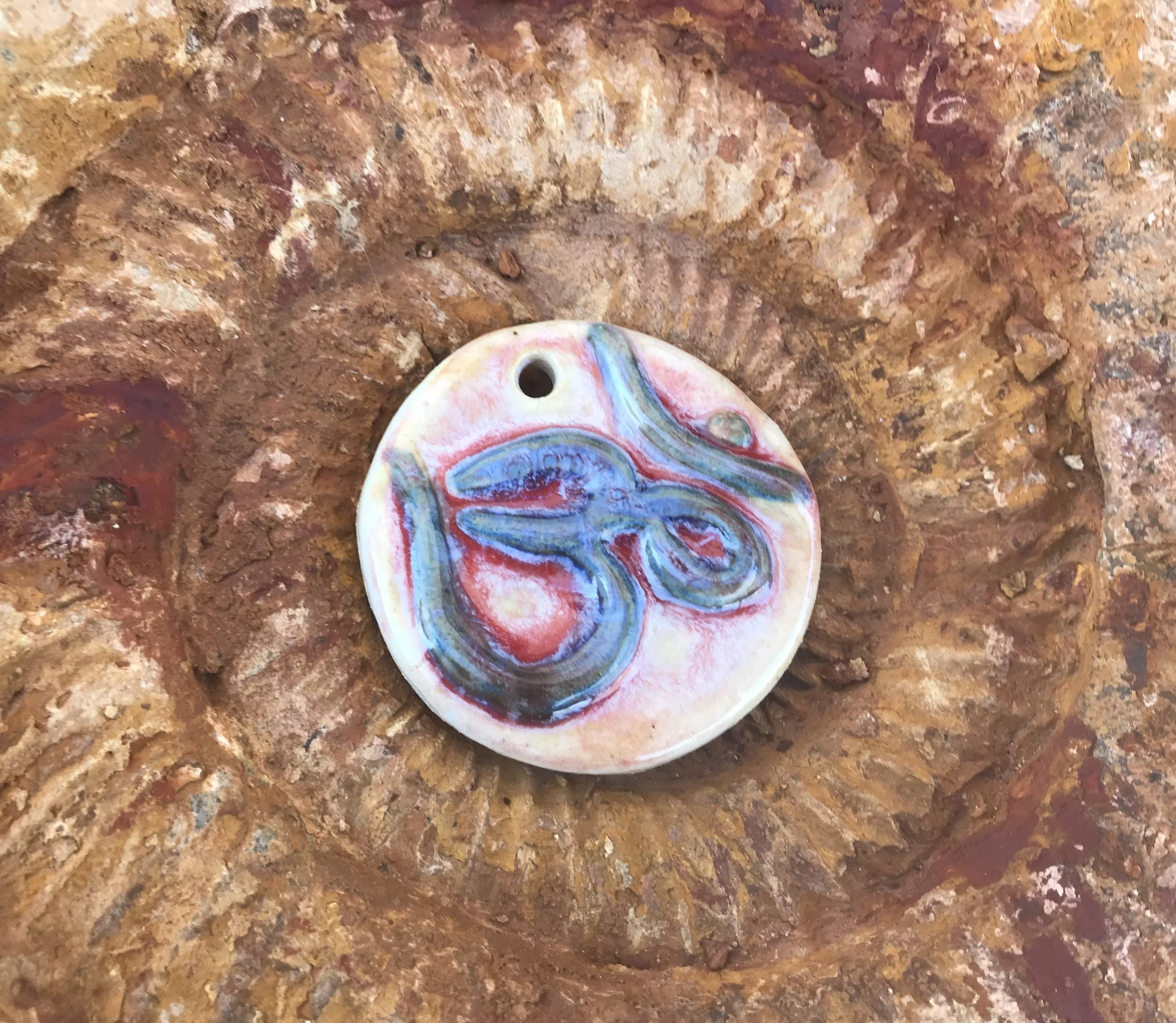 2019 photograph of my handmade OM Pendants