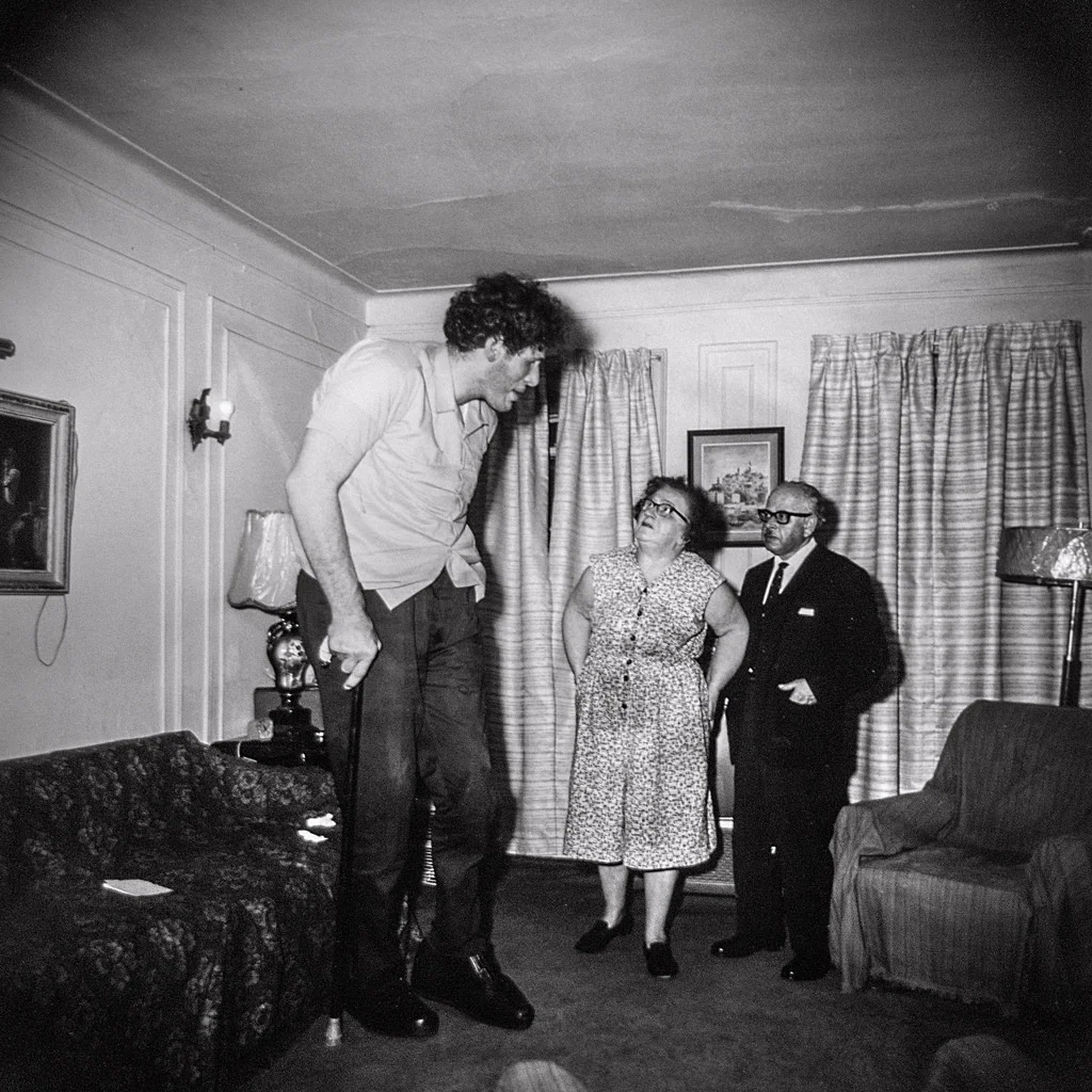 ©1968 estate of Diane Arbus, LLC, A Jewish giant at home with his parents, in the Bronx, N.Y., 1970. “Take pictures of what you fear.” - Diane Arbus