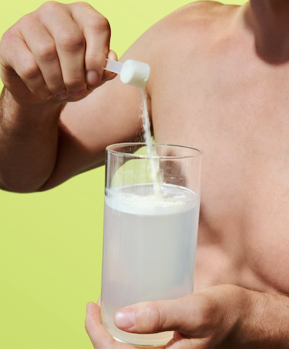 ARMRA colostrum powder being mixed into water to support immune health, gut health, and cold and flu recovery