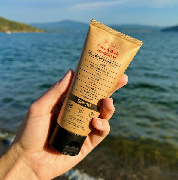 Sky and Sol tallow sunscreen used outdoors showing clean skincare and mineral sun protection featured in skincare guide