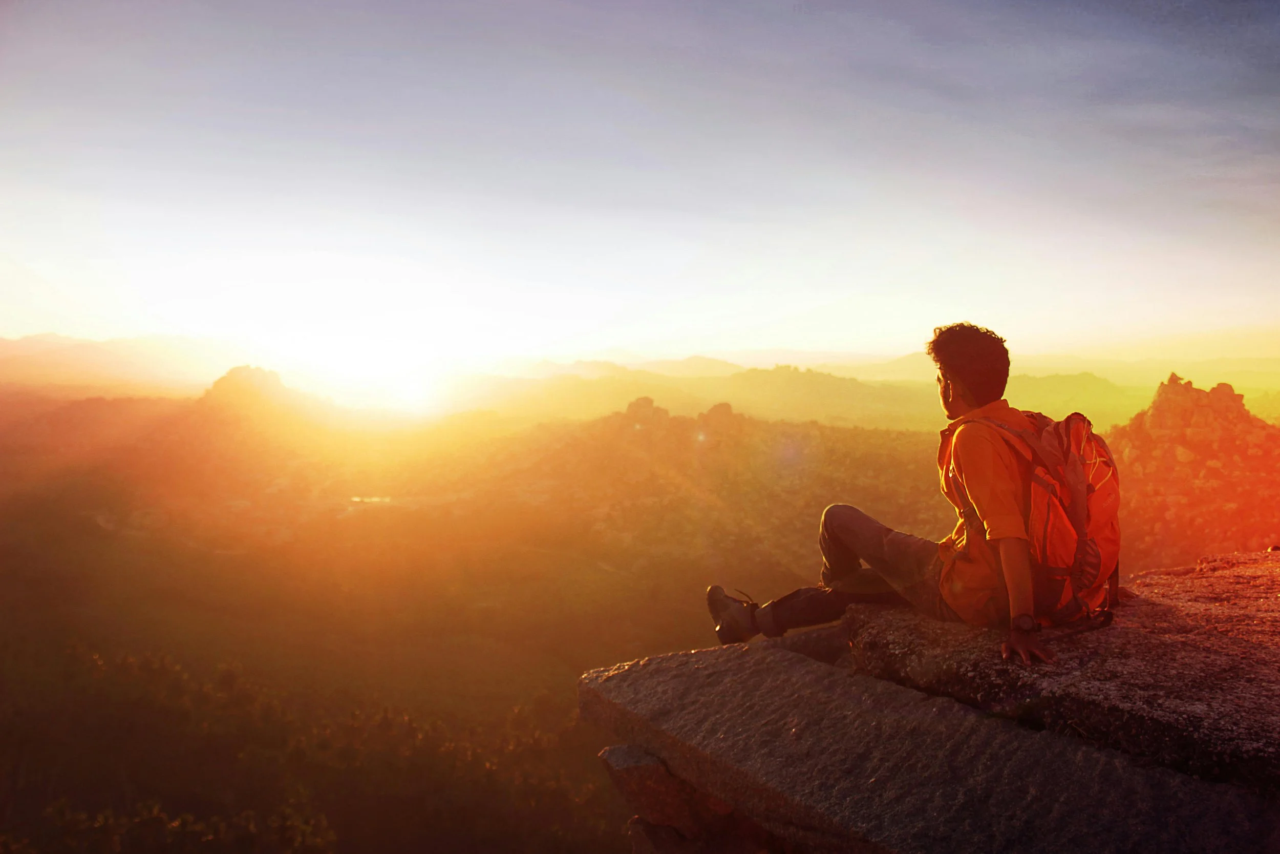Person watching sunrise outdoors