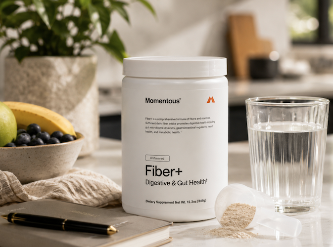 Momentous fiber supplement with water scoop and fruit for daily gut health digestion support and easy mixing routine
