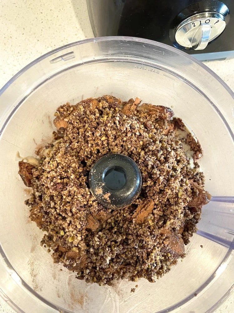 Date mixture and chopped nuts before pulsing together in the food processor