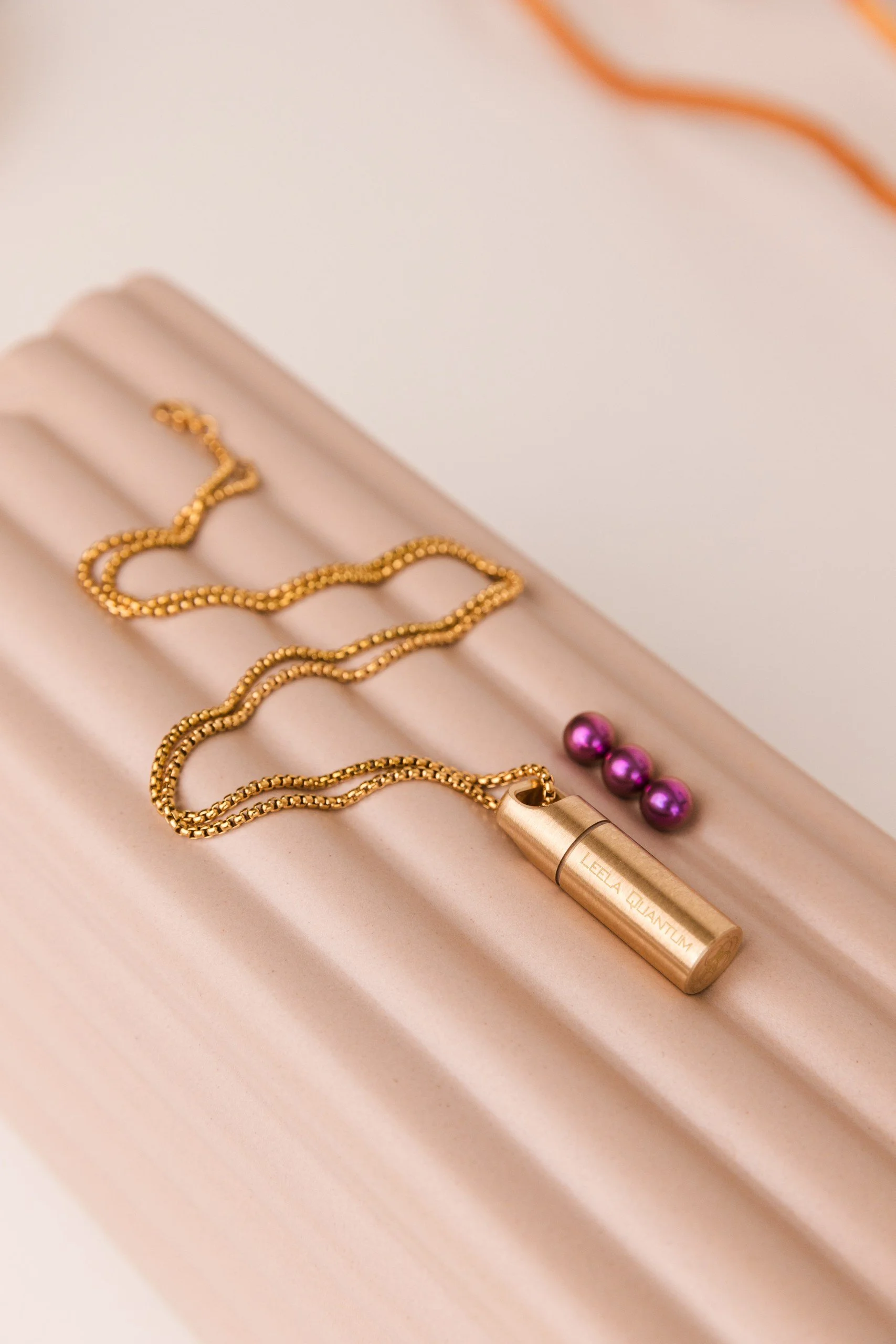 Wearing the Leela Quantum Tech H.E.A.L.360 capsule necklace