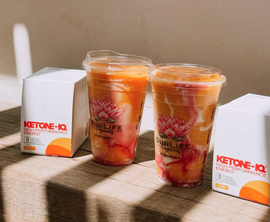 HVMN Ketone-IQ High Performance Energy peach flavor mixed into iced drinks
