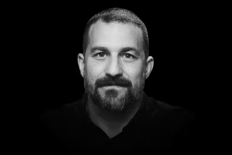 Andrew Huberman portrait associated with Momentous supplements and science backed performance optimization and brain health