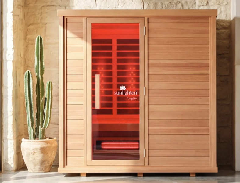 Sunlighten infrared sauna cabin with the heaters glowing
