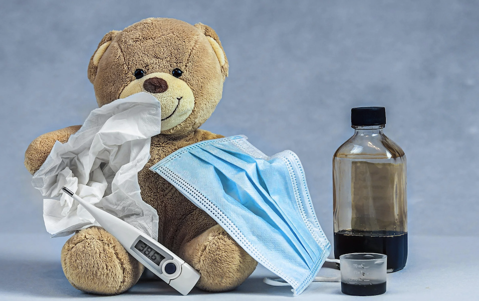 Cold and flu symptoms with thermometer and home remedy support