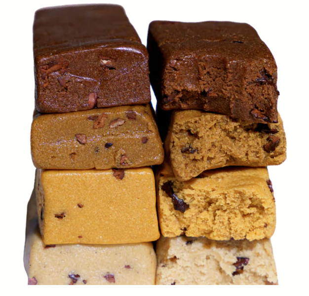 Cross section of Prima protein bar flavors showing a soft, fudgy texture