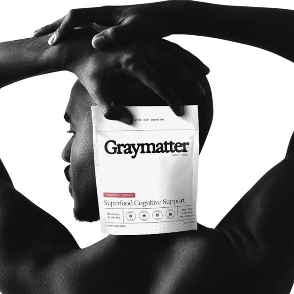 Graymatter Bright Mind nootropic drink mix bag held in hand