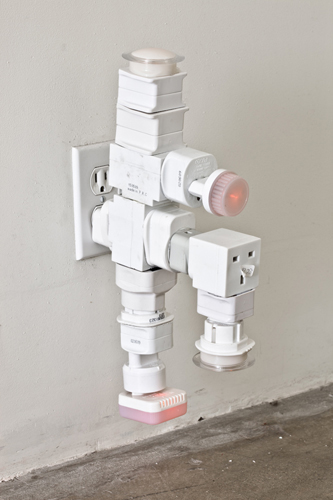 Philippe Parreno, AC/DC Snake, 2010, electric outlet adapters