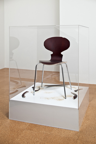 SUPERFLEX, Copy Right, 2007, Wooden chair, sawdust, wood cut-outs, white painted wooden platform, plexiglass case, 47 x 35 1/2 x 35 1/2 in.