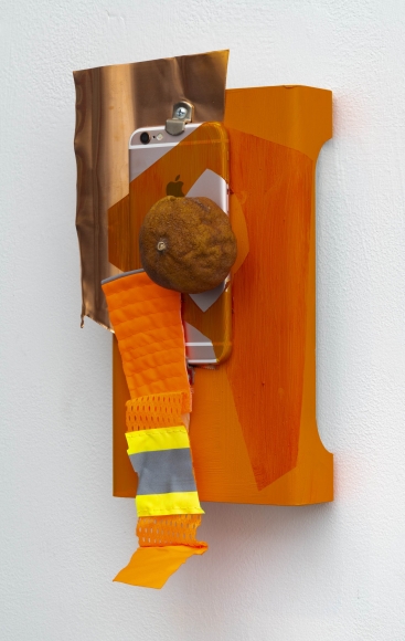 Jessica Stockholder, Infrared, 2018, Hard drive case, copper foil, dried clementine, fabric, hardware, glue, iPhone, oil paint, 12.5 x 6 x 4 inches
