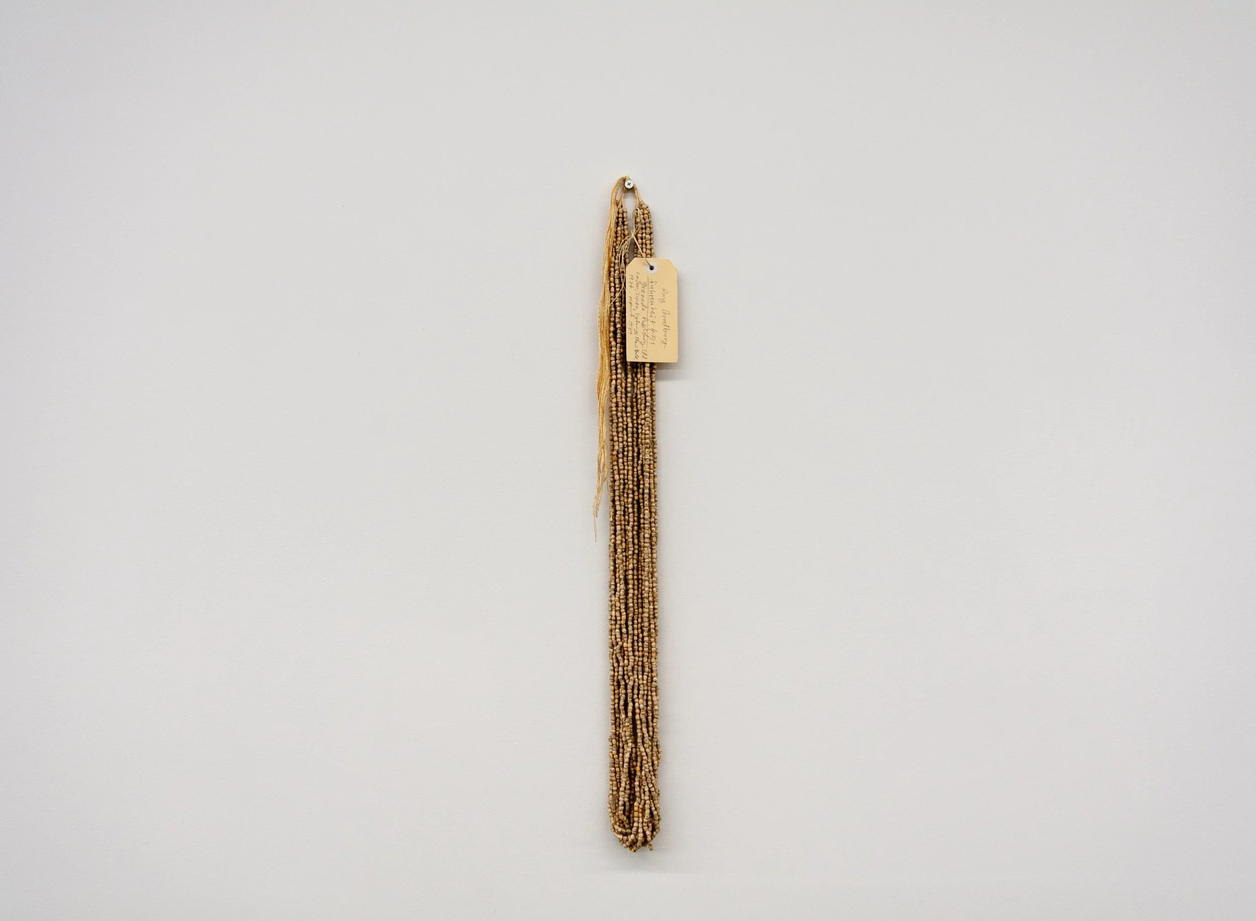 Simryn Gill, Pearls (Ray Bradbury, Fahrenheit 451, Granada Publishing Ltd London, Toronto, Sydney, New York, 1976) (2024); Paper, glue, cotton; 11 strands, 77.8 cm 