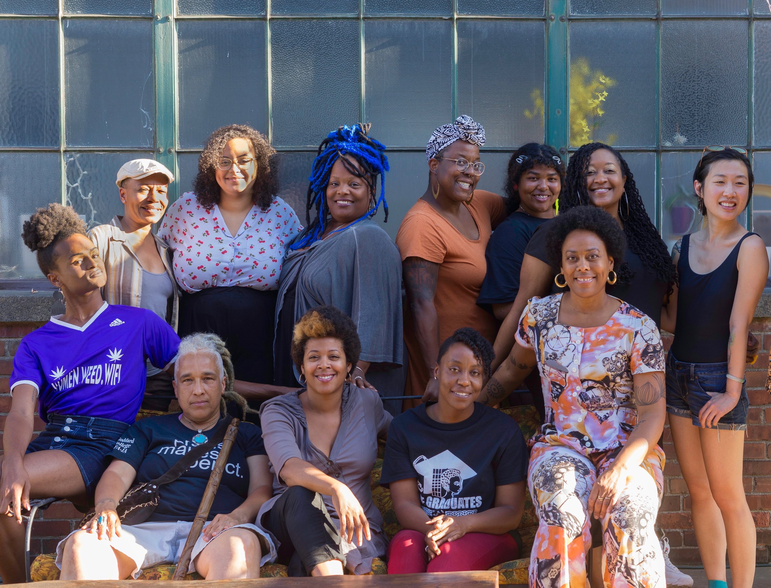 Front row, left to right: Randy Ford, Storme Webber, Shontina Vernon, Taece Delfilo, Lara Davis. Back row, left to right: Anastacia Renee, Jackie Vaughn, Christa Bell, Jehan Osanyín, Jazmine Speed, LaShawnDa Pittman, Anis Gisele. Photo Credit: Chloe Collyer