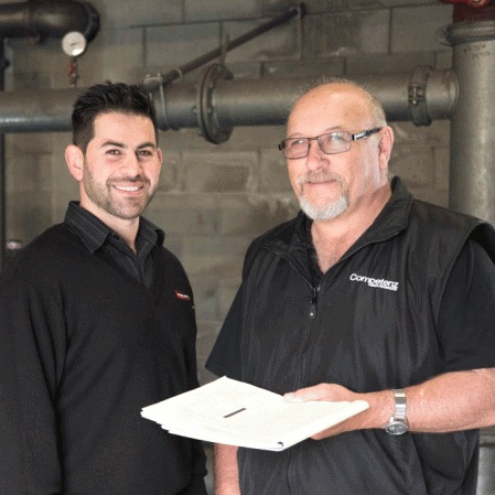 John Stevenson (right), previously COMPETENZ trainer, with Maz Gharib (left) FSS Northern Region Operations Manager. Source www.competenz.org.nz (2015)