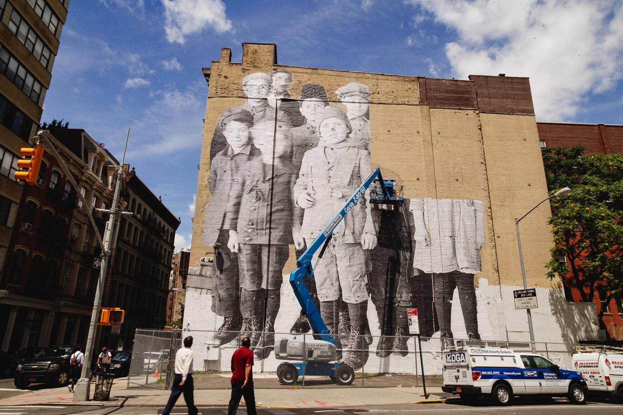 STREET ART NYC: JR’s “Unframed, Ellis Island” Installed at DDG’s 100 Franklin Street