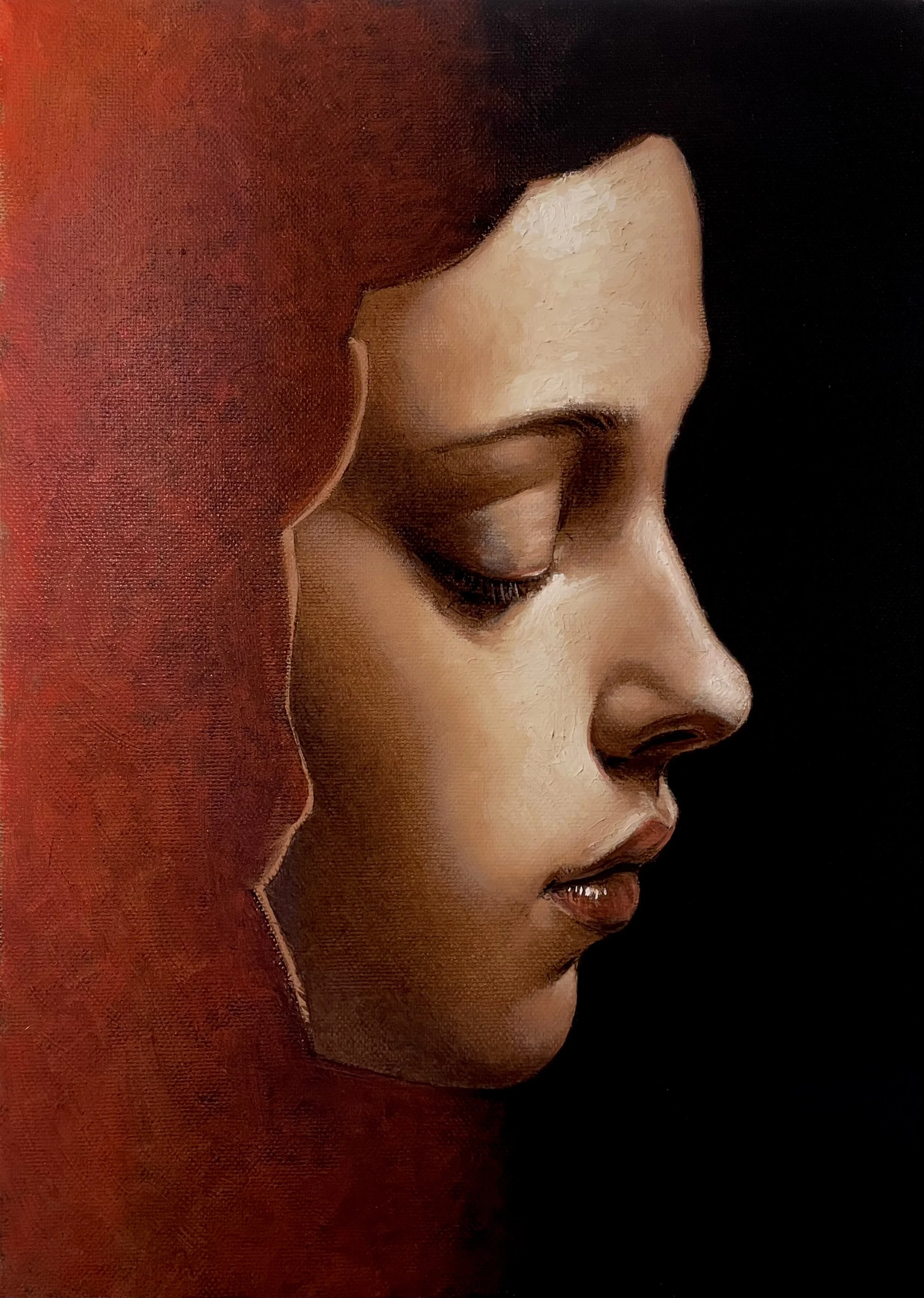 An oil painting with classical elements of a close-up of a woman's face in profile with her eyes closed, against a black background, wearing a red hood.