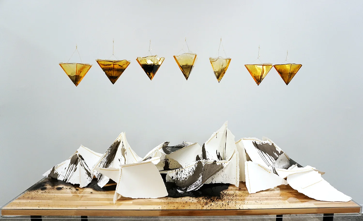 Uncertain Form is an installation of sugar, ink and paper that reflects my personal experience with diabetes. Ink is added to cast-sugar vessels as a marker of unpredictability and change over time. This characterizes the complex relationship betwee…