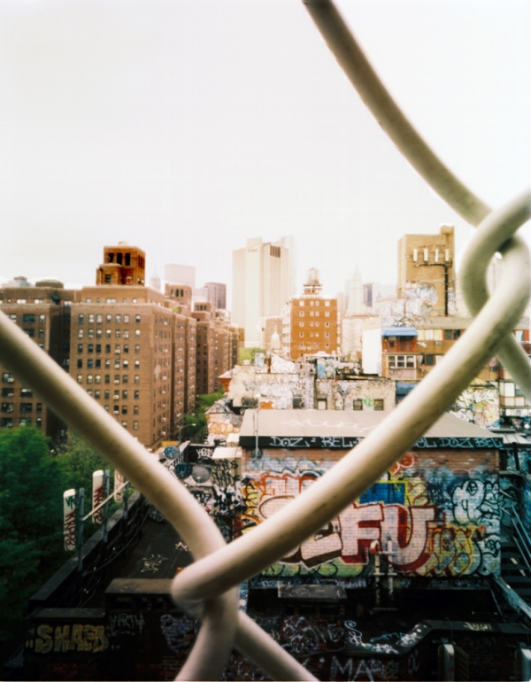 View of Manhattan through chain barrier on bridge