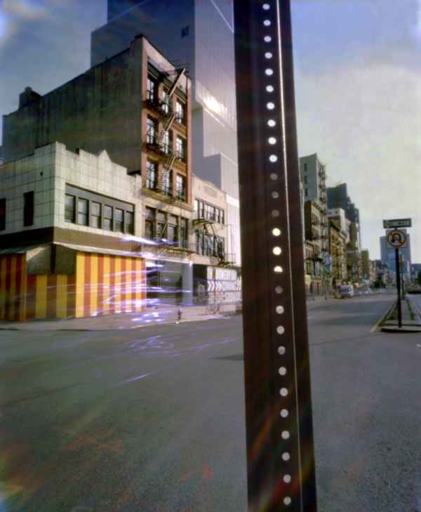 Bowery with pole in foreground