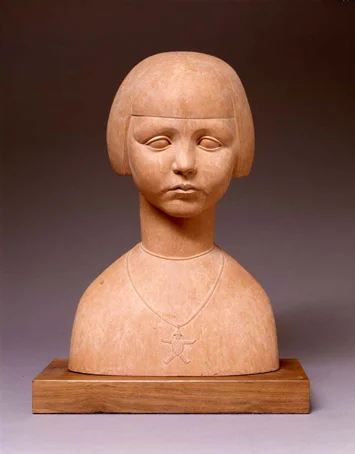 Statue of a terra cotta girl wearing a necklace