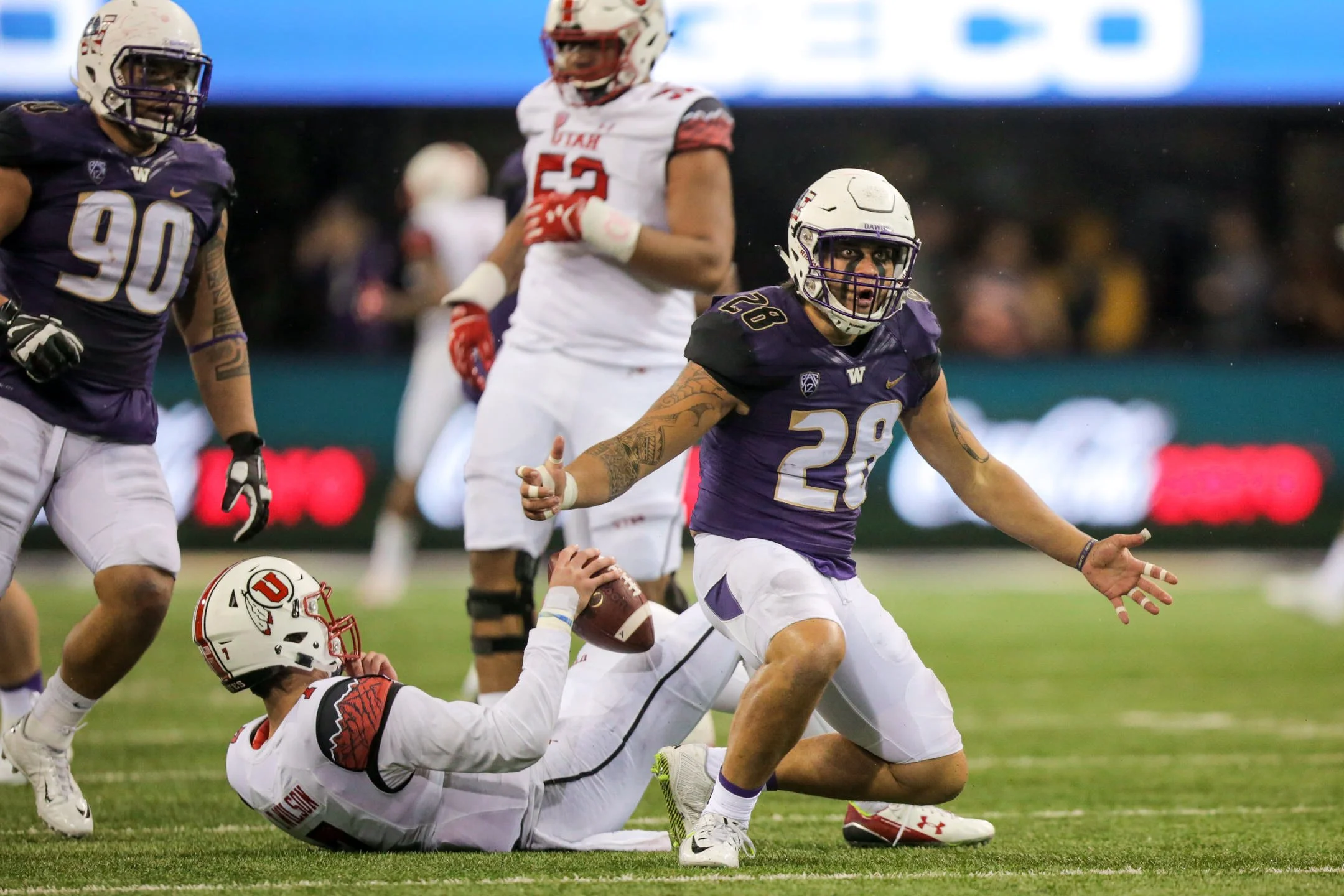 University+of+Washington+Huskies+Football+Linebacker+Psalm+Wooching+Intimates+and+Celebrates+after+sacking+University+of+Utah+Quarterback.jpg