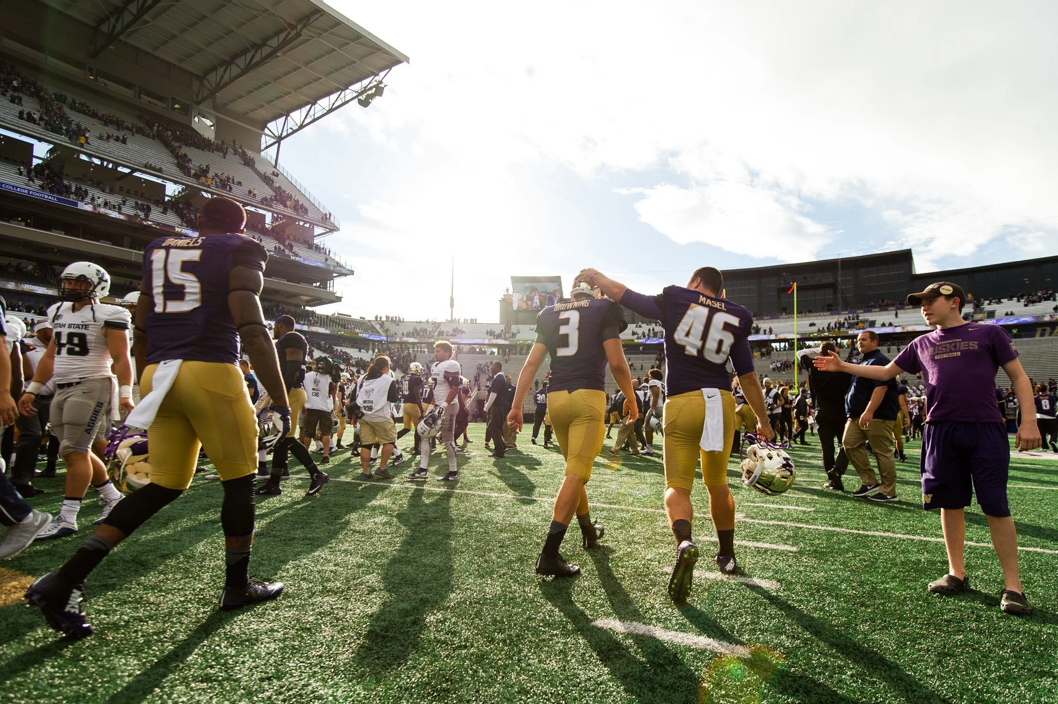 University+of+Washington+Huskies+Football+Quarterback+Jake+Browning+and+Long+Snapper+Ryan+Masel+Walk+Off+Field.jpg