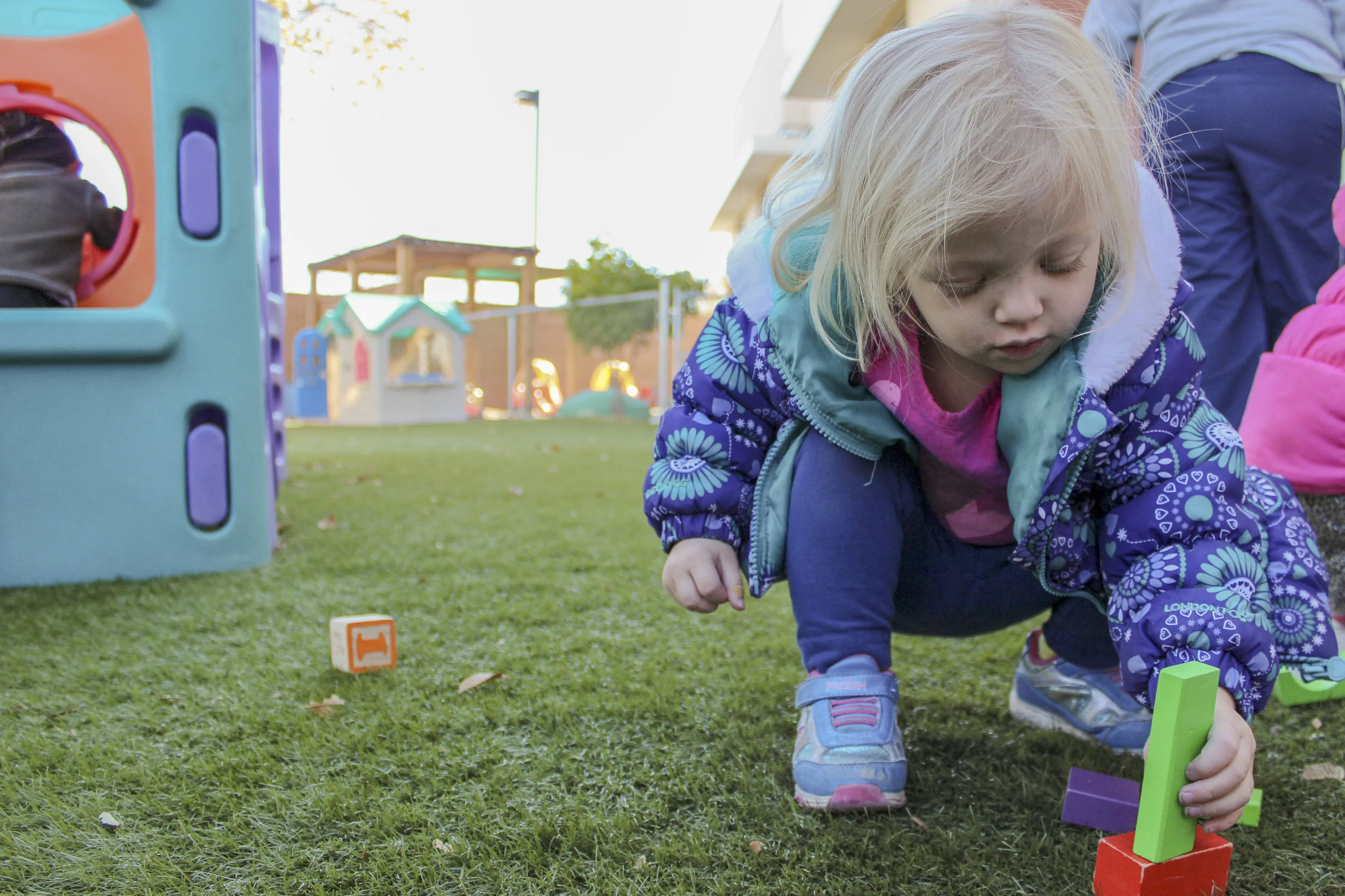 Ruby plays with blocks during recess at CLNKids. Children at CLNkids are allowed to be in the program for only up to one year to allow the many children on the wait list to have a chance of going through the education program at CLNKids