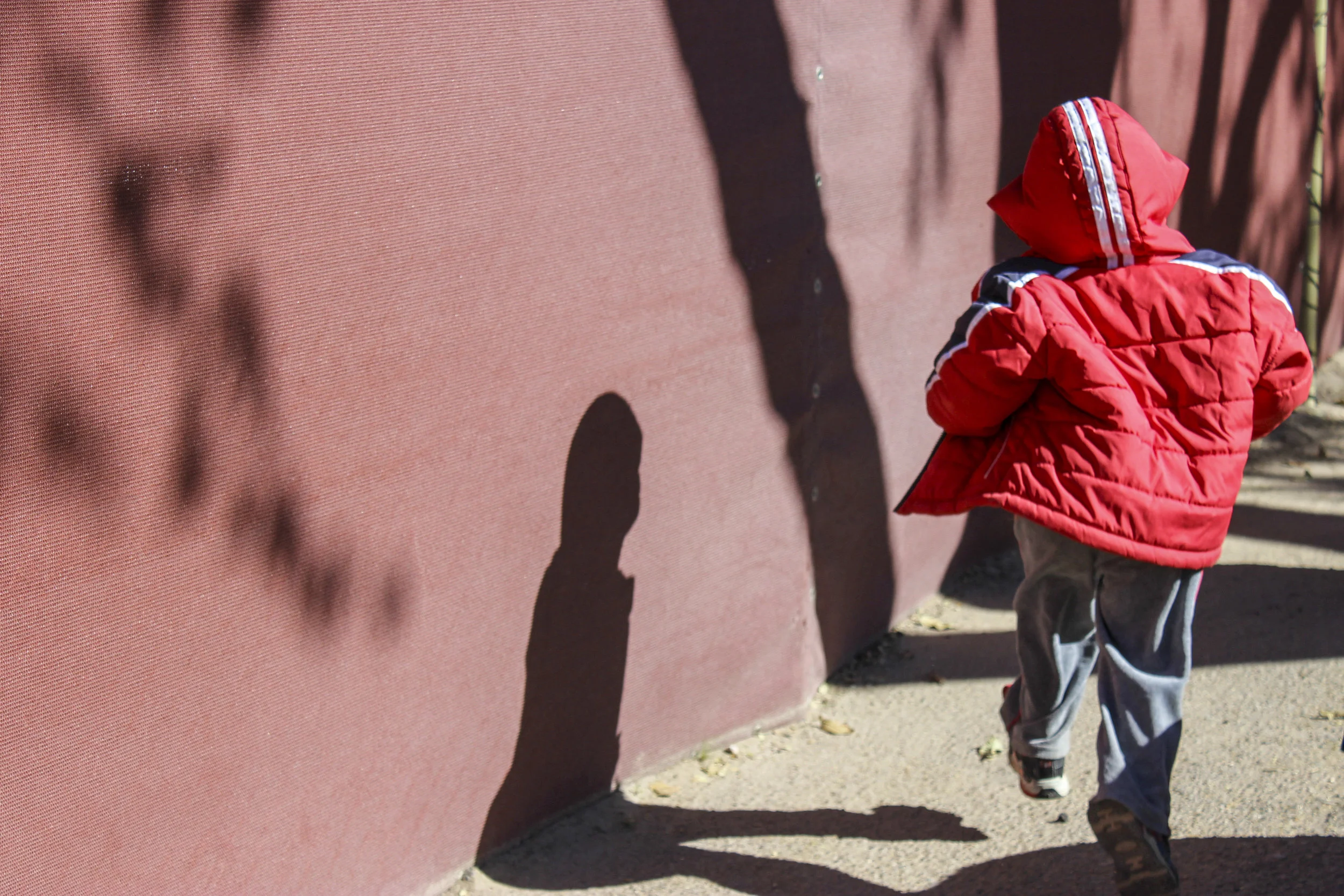 Emilio runs through the playground at CLNKids on Nov. 26, 2014. CLNKids is a place many children call home, and is often a sanctuary away from the chaos of homeless shelters, hotels and living in cars.