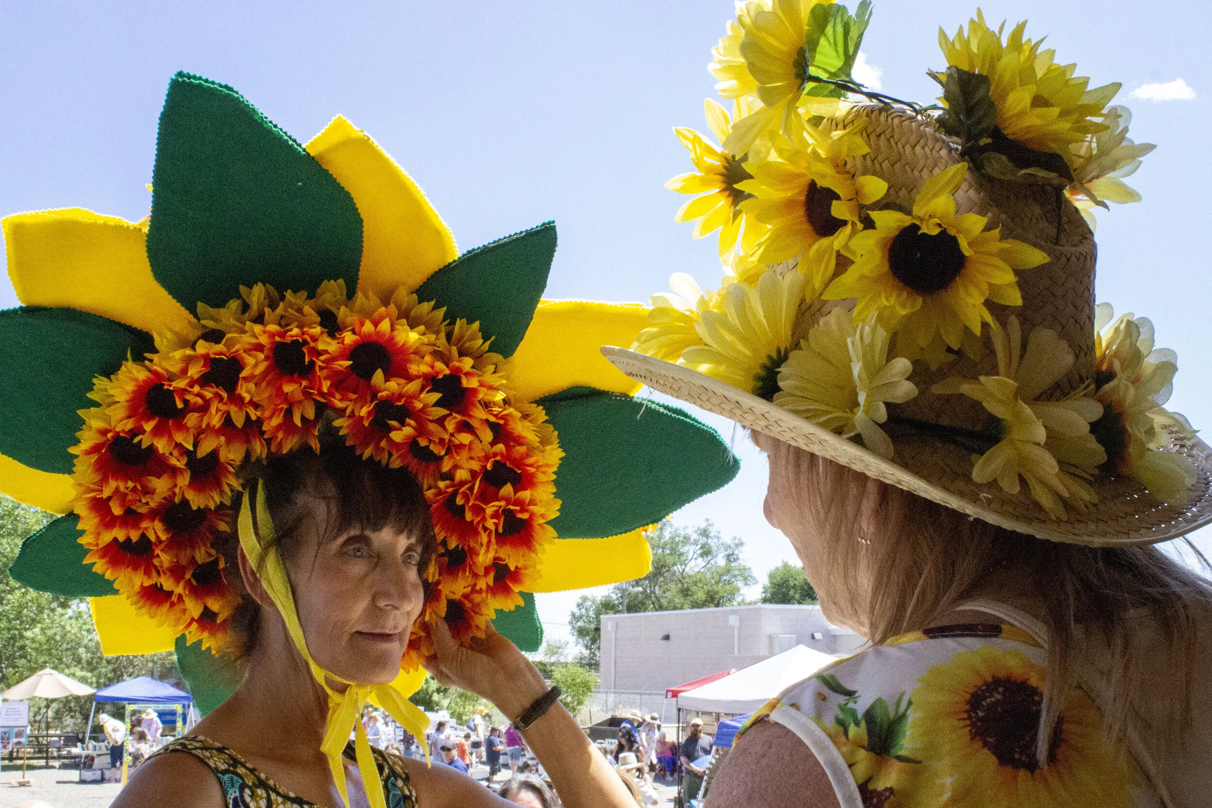 Taza Webb speaks to another contestant before the start of the hat parade.