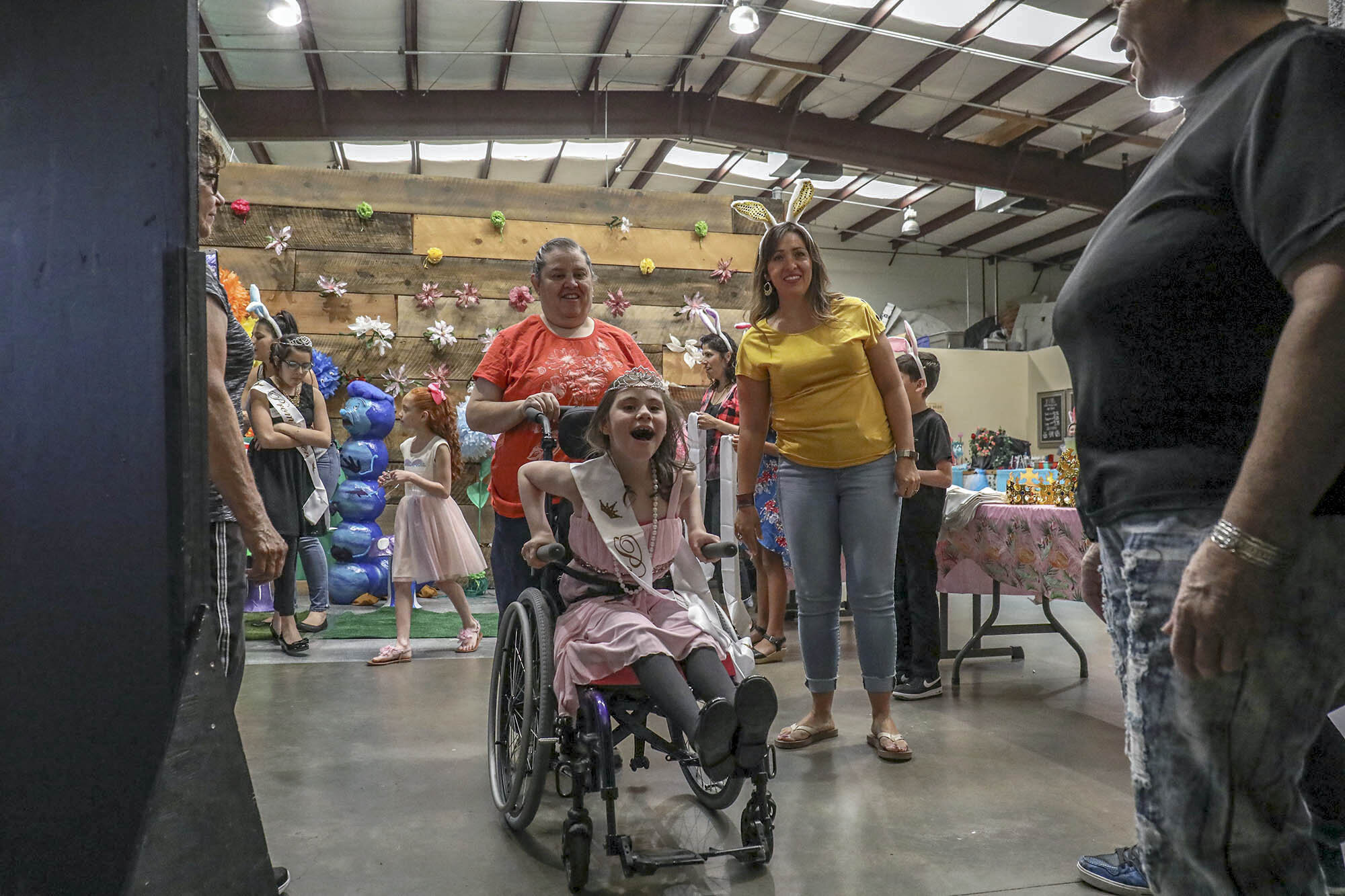 Moriah Garcia, 9, yells with excitement as she is escorted into the prom by her grandmother. This was Garcia’s first time attending the event and got her ears pierced for the event. Garcia attends El Camino Rael Elementary School in Santa Fe. 