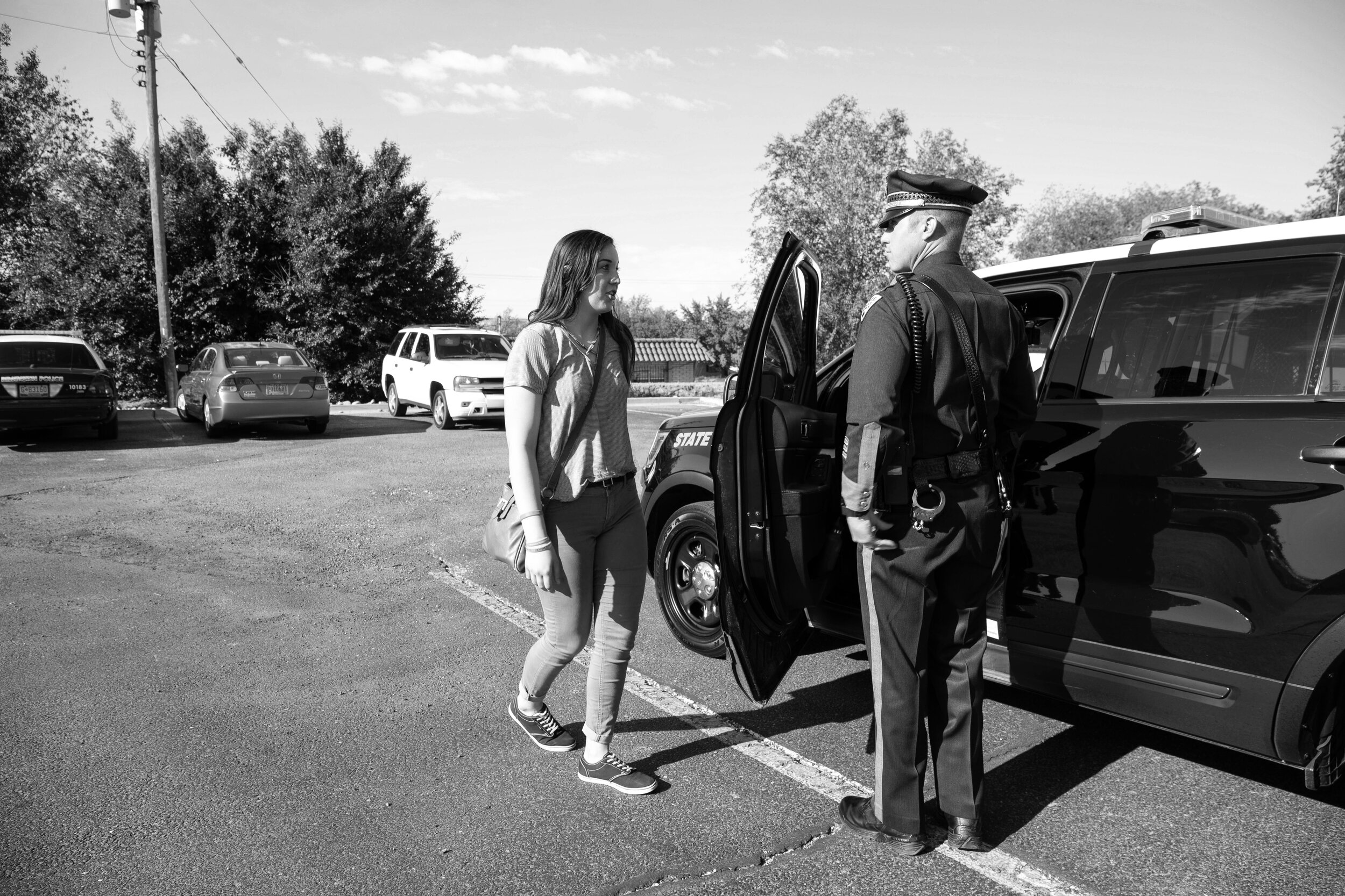  Sierra asks Officer Oliver a question outside the Farmington Court House. Sierra has gone on countless ride alongs with different law enforcement agencies in the New Mexico, including State Police, Las Cruces Police Department, and the Aztec Police 