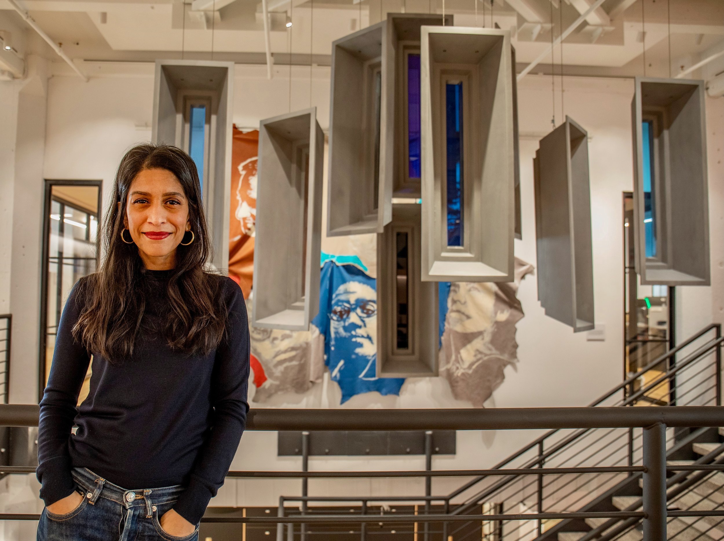  Caption: Insha Rahman, Vice President of advocacy and partnerships at the Vera Institute of Justice, stands for a portrait at the Vera offices in Brooklyn. In the backdrop are windows made by an artist meant to replicate windows used in jails.  “Im 