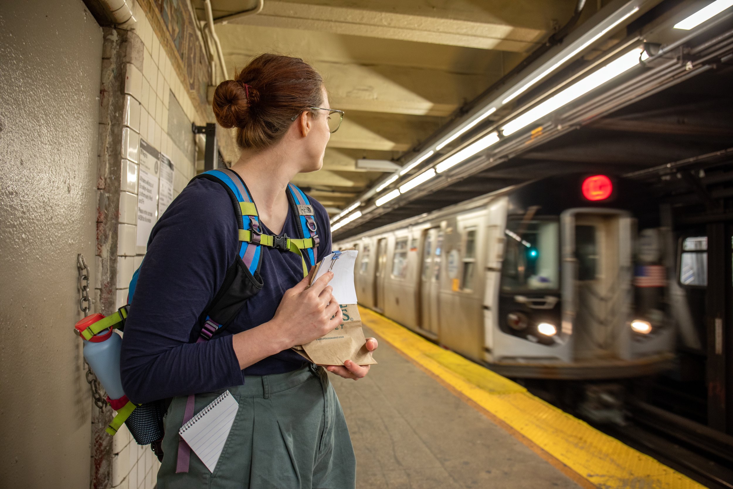  The L Train arrives at Union Square as Grueskin holds the injured warbler to her chest. She worries about the noise of the trains causing further stress to the injured bird.  