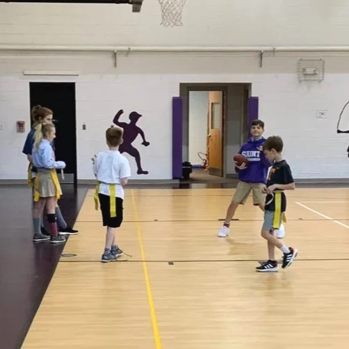 Lower school students at Episcopal School of Knoxville participate in a flag football camp coached by upper school student Rockne Ullrich.